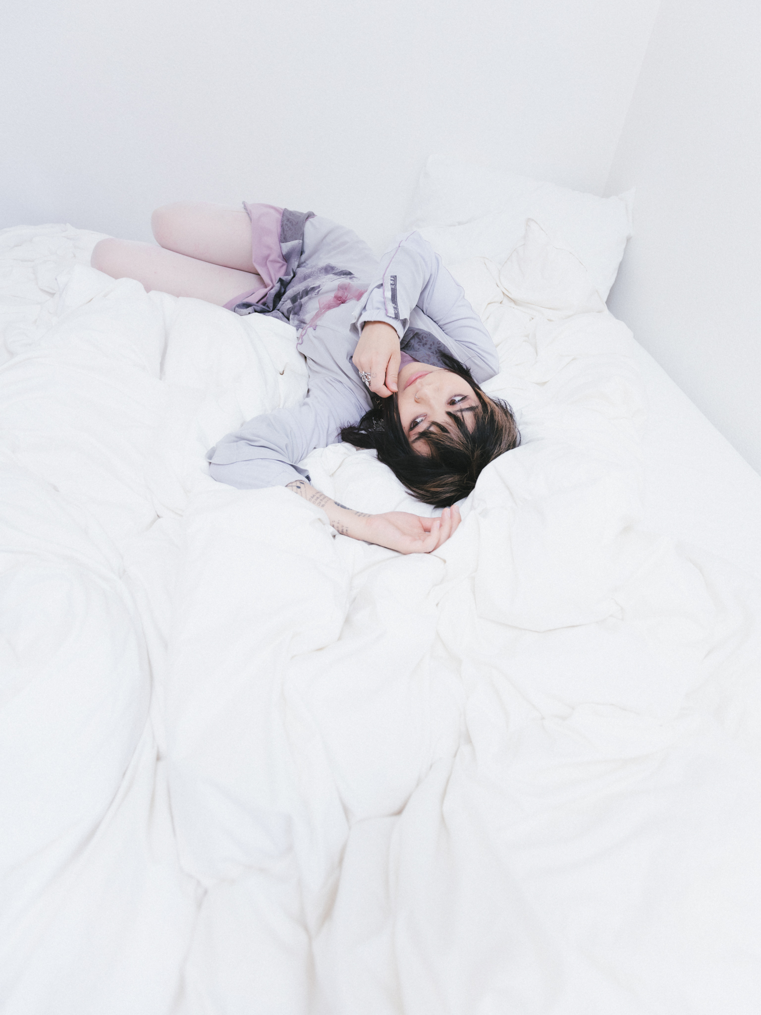y.a.n. resting on a bed